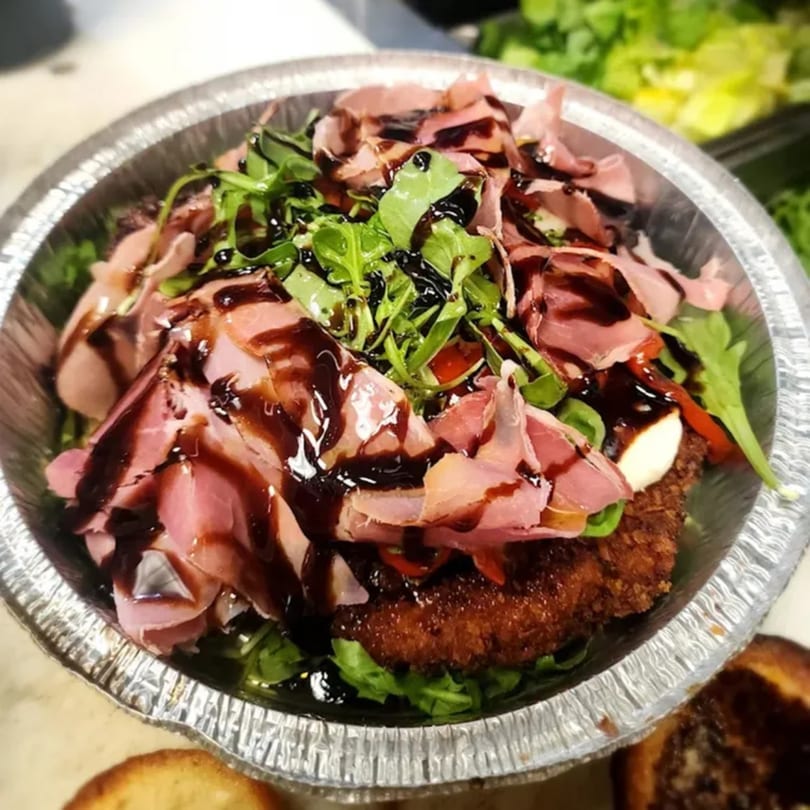 Stallone's Italian Eatery's fried chicken cutlet topped with prosciutto, arugula, and balsamic glaze.